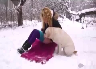 Chick fucking her dog in the snow