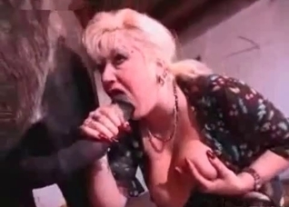 Blonde MILF blows a sexy horse here