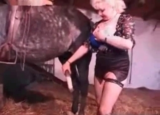 Blonde MILF blows a sexy horse here
