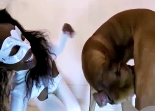 Ebony slut in a white bodysuit fucks a dog