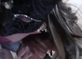 Mask-wearing slut worships a hot cock