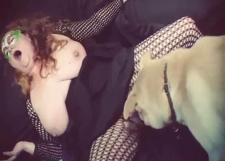 Kinky model and her playful dog enjoy each other