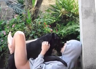 Hoodie hottie makes out with a dog