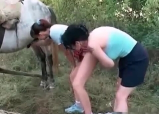 Two girls and their hung horse